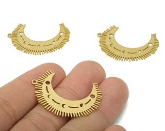 May include: Gold-colored crescent-shaped metal charms. Each charm features a series of small holes and a detailed edge design. The charms have a small loop for attaching to jewelry. The image shows three charms, with one held in a hand.