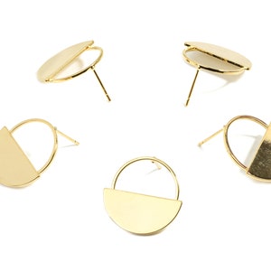 May include: Four pairs of gold-toned earrings with a half-circle design. Each earring has a post and a small back.
