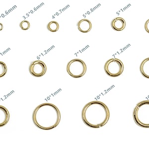May include: Assortment of gold jump rings in various sizes, ranging from 3mm to 10mm in diameter. Each ring is labelled with its diameter and thickness in millimetres.