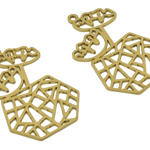 May include: Two gold-toned metal charms with a geometric design. Each charm features a hexagonal shape with a geometric pattern and a floral design on top.