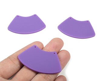 May include: Three purple, fan-shaped earring components with two small holes at the top. The components are smooth and matte, and are displayed against a white background. One component is held in a hand.