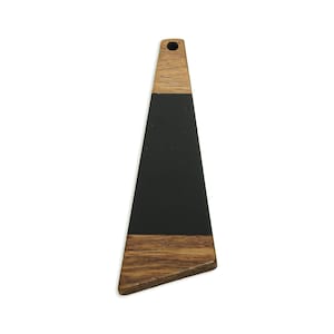 May include: A wooden pendant with a black center and a natural wood grain top and bottom. The pendant is triangular with a hole at the top for hanging. The wood grain is visible on the top and bottom sections.