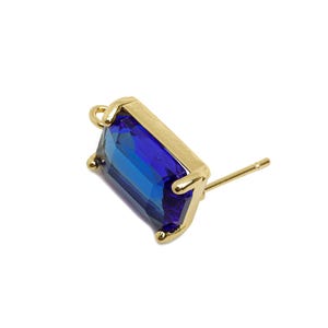 May include: A single gold stud earring featuring a rectangular, deep blue gemstone. The gemstone is set in a gold bezel and has a post for piercing. The earring is set against a white background.