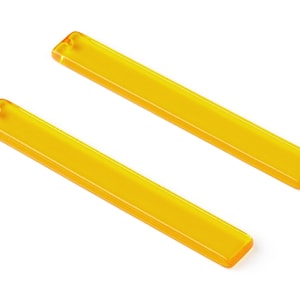 May include: Two long, thin, bright yellow acrylic rods.