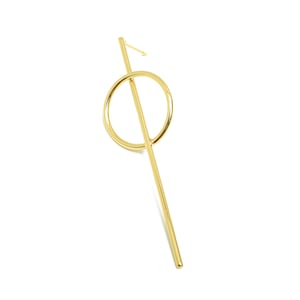 May include: Gold-toned geometric earring with a long, thin bar and a circle attached to the bar.