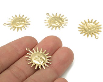 May include: Gold-colored sun charms with a smiling face and radiating rays. Each charm has a small loop for attaching to jewelry or other crafts. The charms are made of metal and have a matte finish.