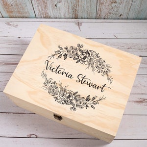 May include: A wooden box with a floral design and the name "Victoria Stewart" engraved on the lid.