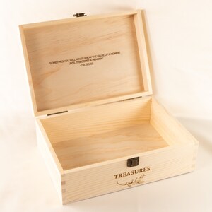 May include: A wooden box with a hinged lid, engraved with the quote "Sometimes you will never know the value of a moment until it becomes a memory - Dr. Seuss". The box is labeled "TREASURES" with a floral design.