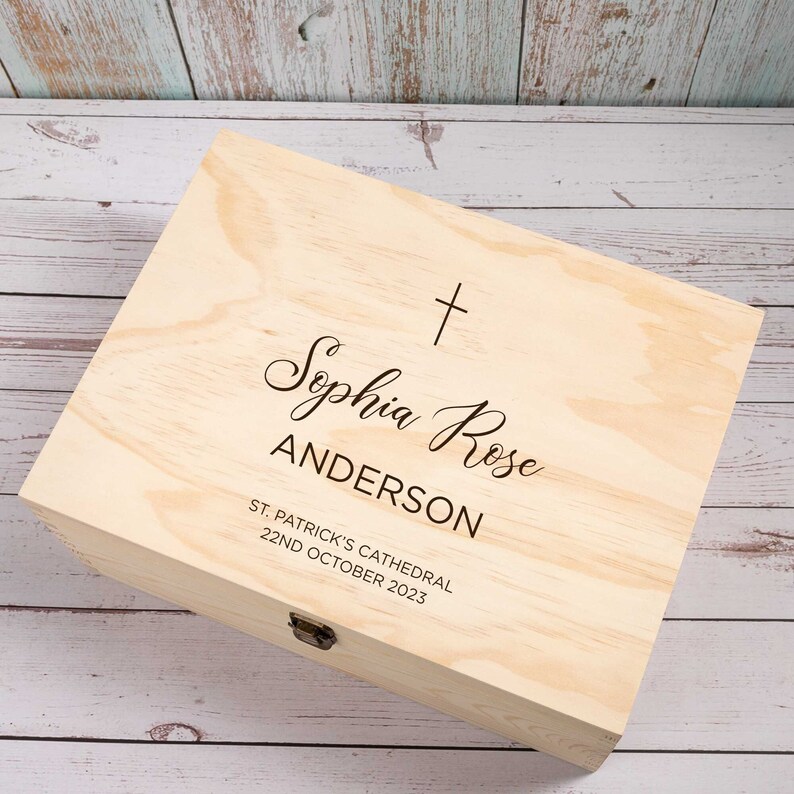 May include: A wooden keepsake box with a cross and the inscription "Sophia Rose Anderson, St. Patrick's Cathedral, 22nd October 2023".