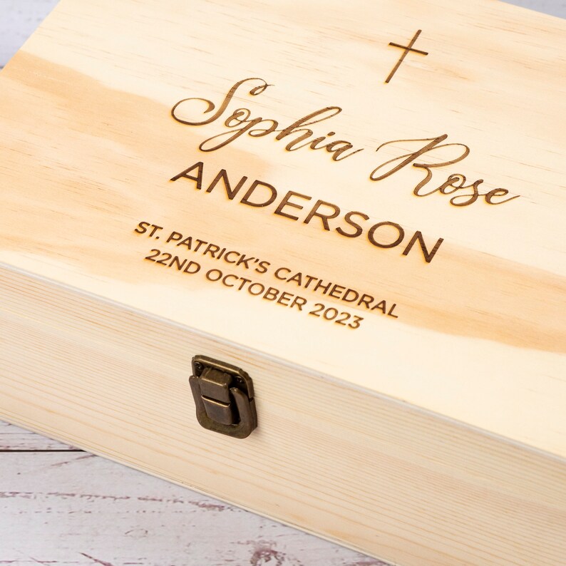 May include: A wooden keepsake box with a brass latch. The box is engraved with the text "Sophia Rose ANDERSON, ST. PATRICK'S CATHEDRAL, 22ND OCTOBER 2023".