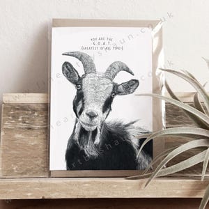 Puede incluir: Una ilustración en blanco y negro de una cabra con el texto "You are the G.O.A.T. (Greatest of all time)" en una tarjeta blanca.