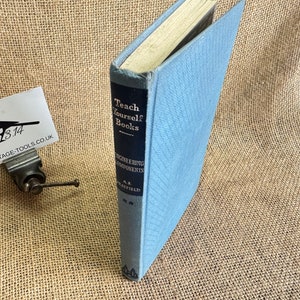 May include: A blue hardback book titled "Teach Yourself Books Engineering Components" by A.F. Lovesey. The book is on a hessian background.