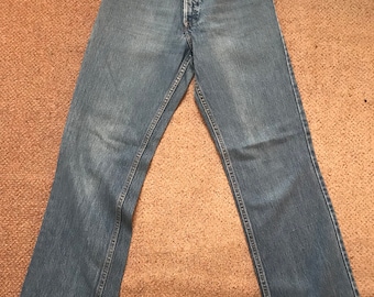May include: A pair of light blue denim jeans with a high waist and a straight leg.