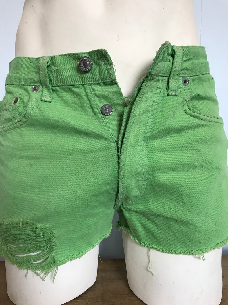 green levi shorts