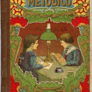 May include: Vintage book cover with the title "MANUSCRITO METODICO" in gold lettering. The cover shows illustrations of two children studying under a green lamp, framed by floral and leaf designs. The book's spine is brown.