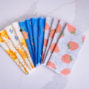May include: A set of 10 reusable cloths in a variety of patterns, including honeycomb, floral, and strawberries. The cloths are made of a soft, absorbent fabric and are perfect for cleaning up spills, wiping down surfaces, and drying dishes.