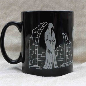 Haunted graveyard mug - black with white ghostly design - skeleton & ghost - gift