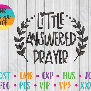 May include: Black and white graphic design with a wreath of leaves around the text "Little Answered Prayer".