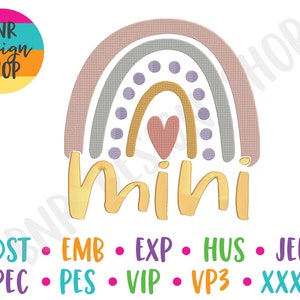 May include: A rainbow with a heart in the center and the word "mini" in gold lettering below. The rainbow is made up of pink, gray, and yellow stripes with purple polka dots.