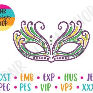 May include: A purple, green, and yellow Mardi Gras mask with intricate details. The mask is a traditional symbol of the carnival season.