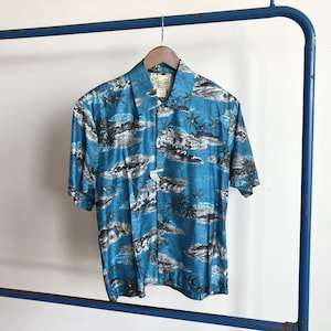 May include: A rustic wooden sign with the text "Welcome to our home" in white lettering. The sign features a distressed finish and a simple, inviting design, perfect for a front porch or entryway.