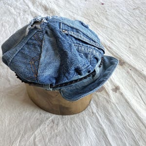 May include: A trio of ceramic mugs with a speckled, matte finish in cream, light grey, and dark grey. Each mug features a simple, minimalist design, ideal for tea or coffee.