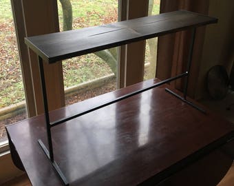 Black steel table with reclaimed wood top