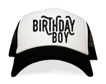 May include: A white and black trucker hat with the text "Birthday Boy" in black lettering.