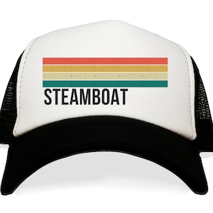 May include: A white and black trucker hat with a retro-style rainbow stripe and the text "STEAMBOAT" in black.
