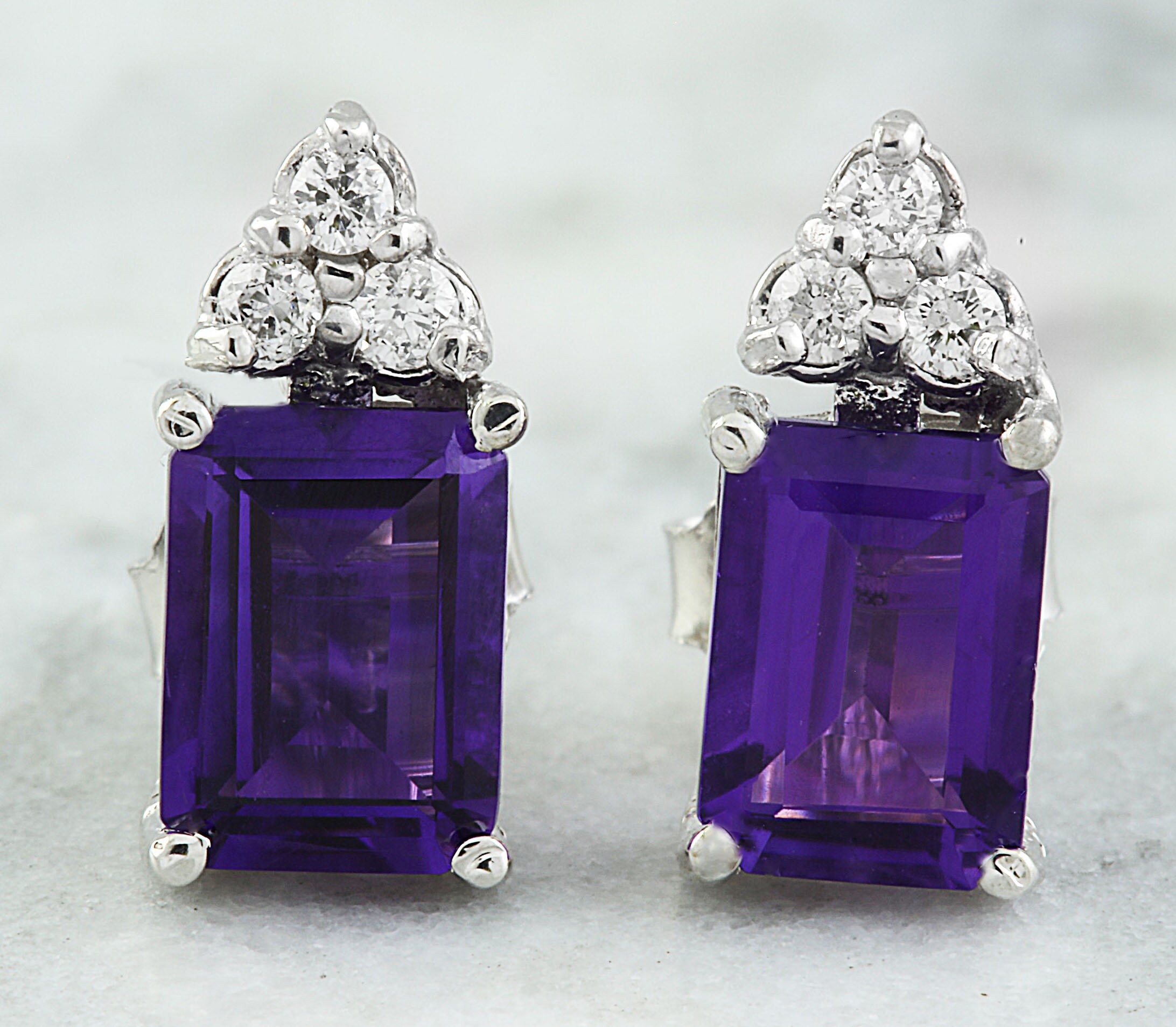 amethyst and diamond earrings in 14k white gold
