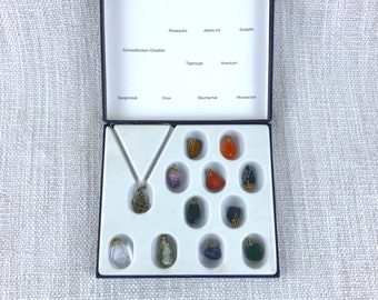 Collection jewelry gems pendants in a box