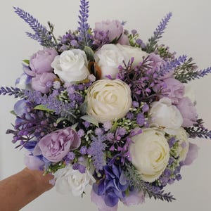 Brides Lilac/Lavender & White Bridal Handtied Posy Bouquet with Ranunculus and Rose Buds.