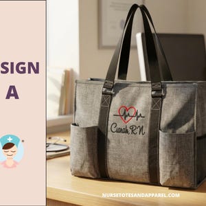 May include: Gray tote bag with black straps and side pockets. Features a red heart and heartbeat design with the name "Ciarah, RN" embroidered in black. The bag has a professional and functional design.