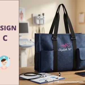 May include: A navy blue tote bag with black handles and side pockets. The bag features a pink heartbeat design with the name "Elizabeth NP" embroidered on the front. A stethoscope, clipboard, and tablet are on the wooden surface.