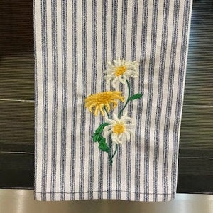 Embroidered Daisies on a 100% cotton Navy and White ticking kitchen towel