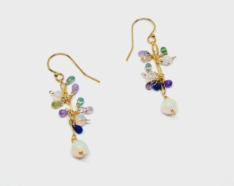 Earrings with stones attached to a chain