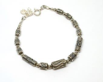 Sterling silver bracelet with clasp and Balinese beads