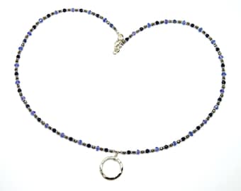 Necklace with a solid silver coin