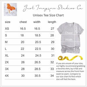 May include: A light gray unisex t-shirt size chart from Just Imagine Studios Co. The chart includes chest, width, and length measurements in inches for sizes XS to 4X. A yellow measuring tape is also shown.