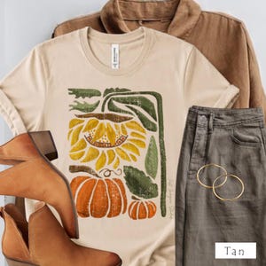 Camiseta unisex de otoño con estampado de girasoles y calabazas, ideal para Halloween.