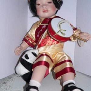 Chinese Kuni -  A Porcelain 22&quot; Sitting Doll with Stool & Panda