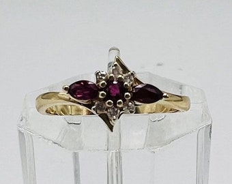 14k Gold Red Ruby Flower Ring with Accent Diamonds