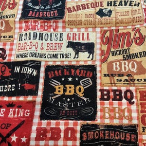 May include: A fabric with a red and white checkered pattern, featuring various BBQ-themed signs. The signs include text like "Smokehouse," "Barbeque Heaven," and "Roadhouse Grill," along with illustrations of a cow and pig.