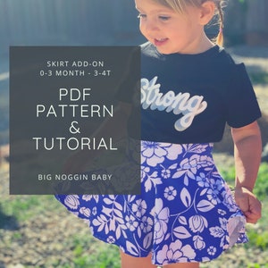 May include: A PDF pattern and tutorial for a skirt add-on for babies and toddlers, sizes 0-3 months to 3-4T. The image shows a young child wearing a blue and white floral skirt with the text "Strong" on their black shirt. The text "SKIRT ADD-ON 0-3 MONTH - 3-4T PDF PATTERN & TUTORIAL BIG NOGGIN BABY" is also included in the image.