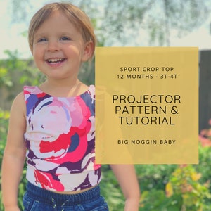 May include: A yellow graphic with the text "SPORT CROP TOP 12 MONTHS - 3T-4T PROJECTOR PATTERN & TUTORIAL BIG NOGGIN BABY" on it. A young child is wearing a colorful floral crop top.