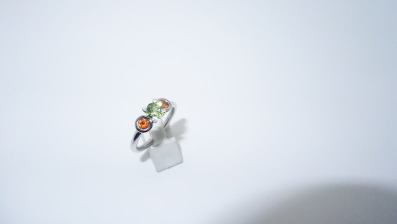 Silver ring with garnet and olivine stones