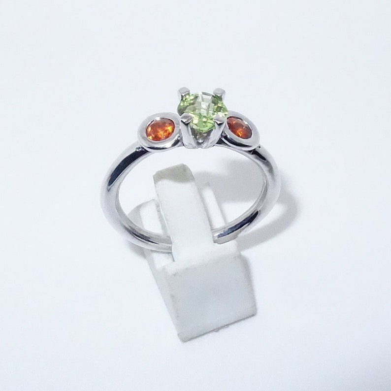 Silver ring with garnet and olivine stones