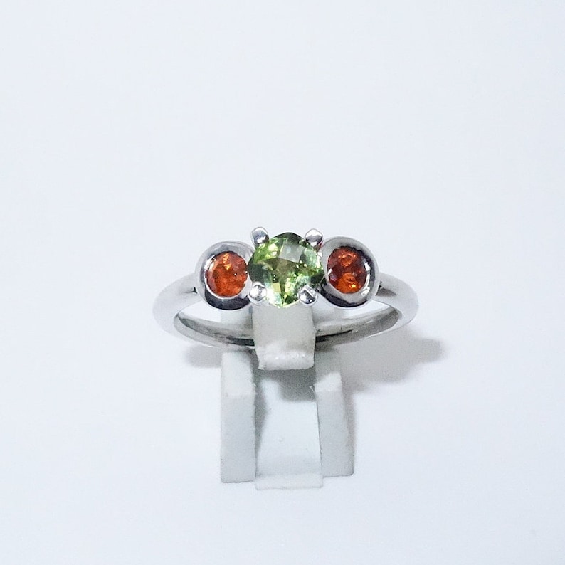 Silver ring with garnet and olivine stones