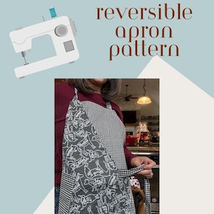 May include: Reversible apron pattern with easy instructions and a video tutorial. The apron features a black and white gingham pattern on the back and a gray fabric with white illustrations on the front. The text says "by the bay bag co."