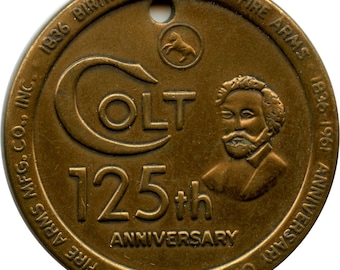 Llavero conmemorativo del 125.º aniversario de Colt Firearms Mfg. Co., 1961. Revólver Colt.